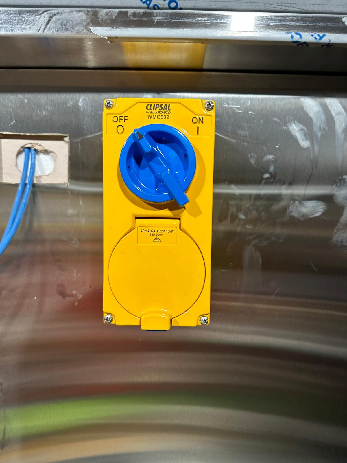 Three phase 32 amp switched outlet installed in a commercial kitchen