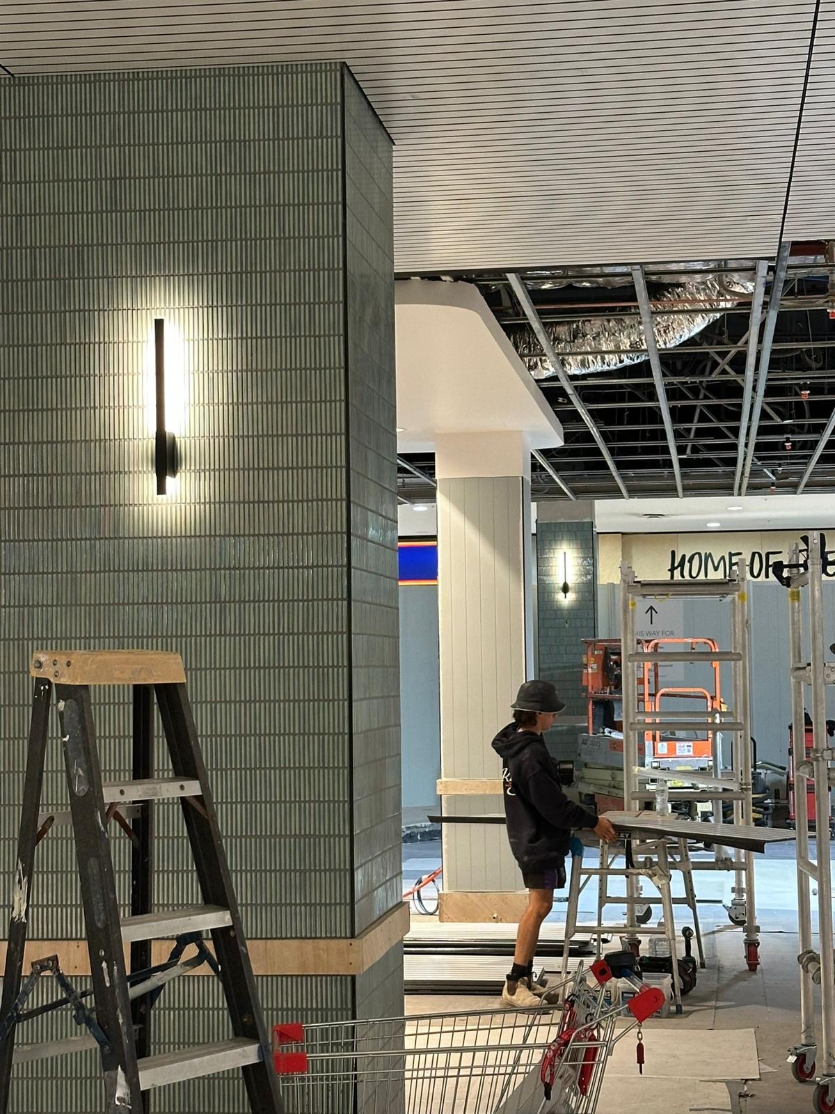 Feature wall lighting installed during a shop fit out