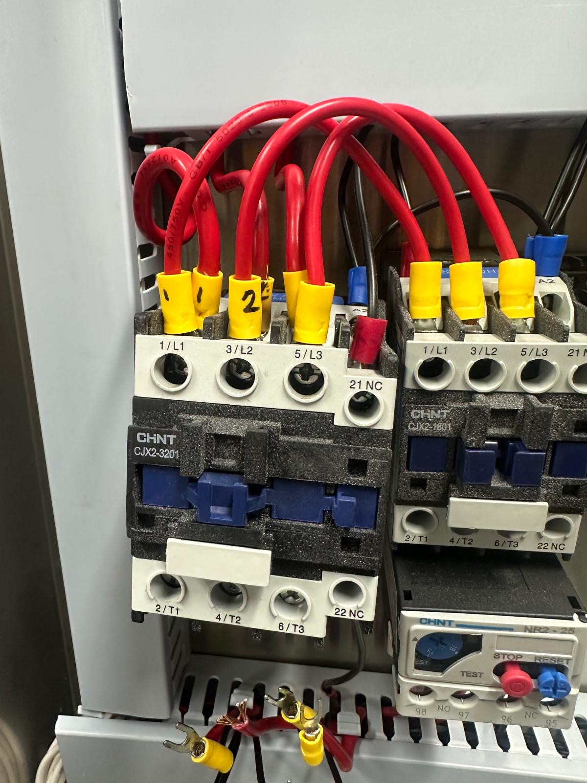 Three phase contactors and overload relay wired in a control panel