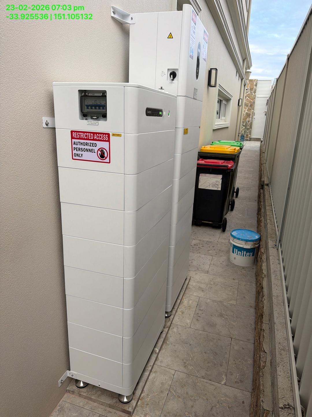 Home battery and inverter system installed beside a house
